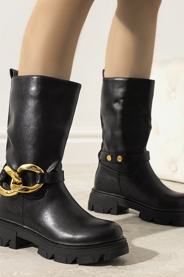 Stivaletti neri isolati con...