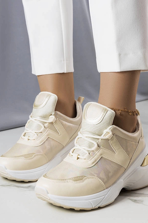 Sneakers beige con inserti metallici...
