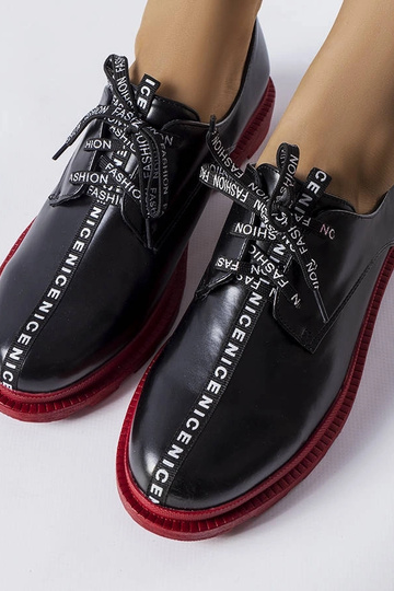 Stivaletti neri con suola a... 2