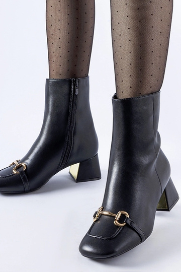 Stivaletti neri con fibbia...