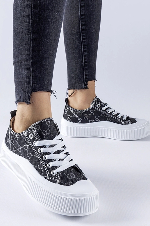 Sneakers nere decorate con monogramma...