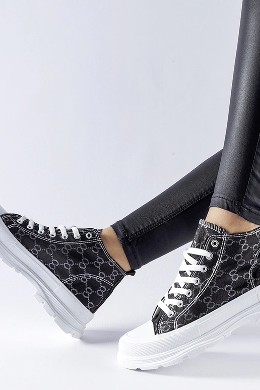 Sneakers nere decorate con monogramma...