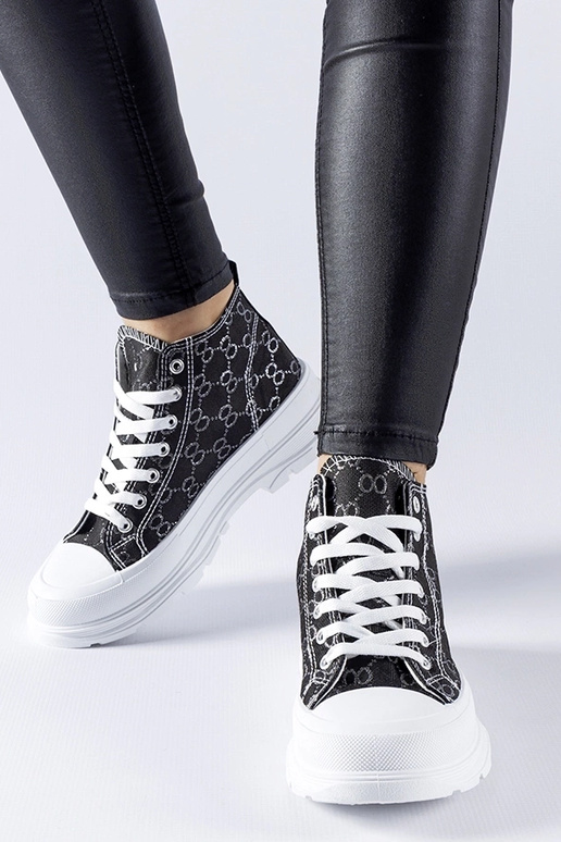 Sneakers nere decorate con monogramma...