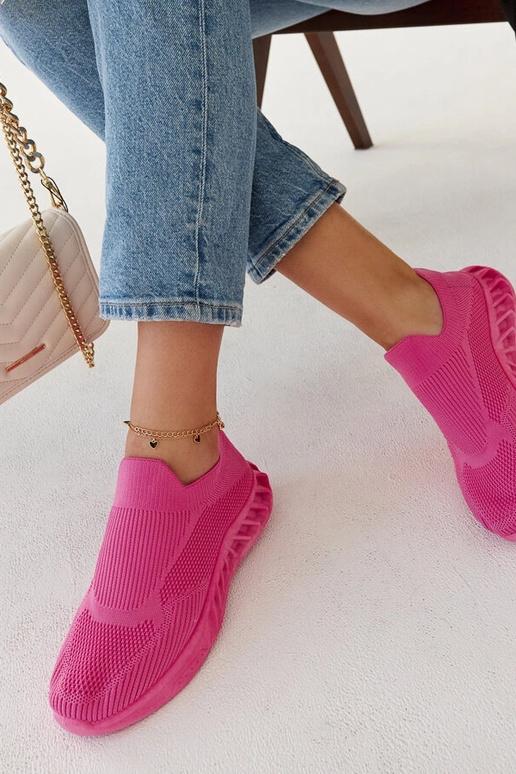 Le scarpe da ginnastica rosa scuro di...