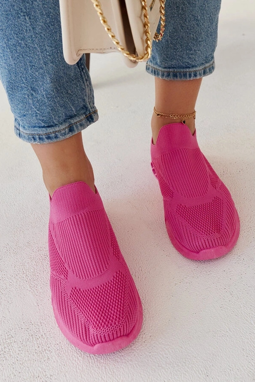 Le scarpe da ginnastica rosa scuro di...