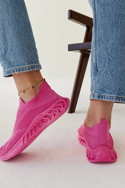 Le scarpe da ginnastica rosa scuro di...