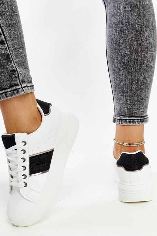 Sneakers bianco-neri con suola più...