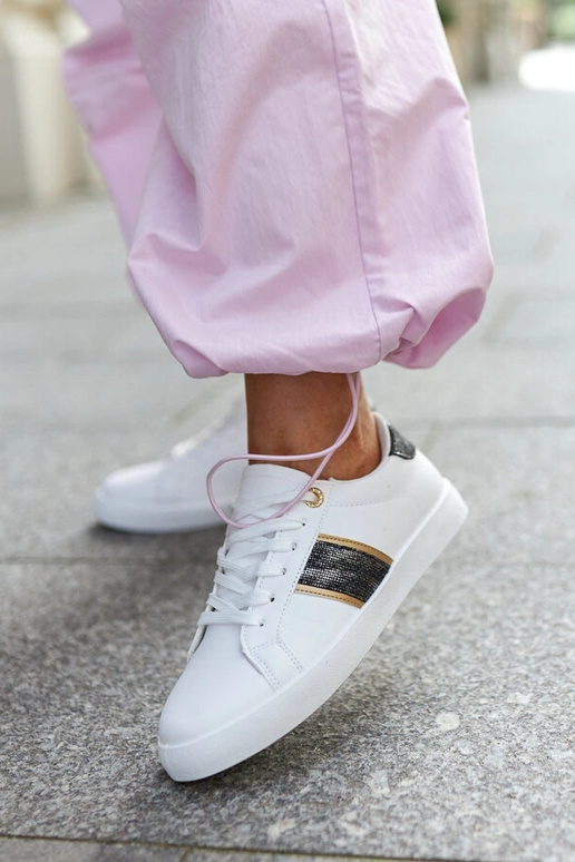 Sneakers bianche con cinturino...