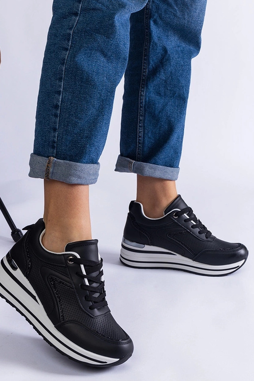 Sneakers nere con plateau decorate...