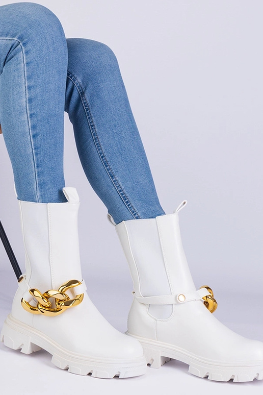 Stivaletti bianchi decorati con una...