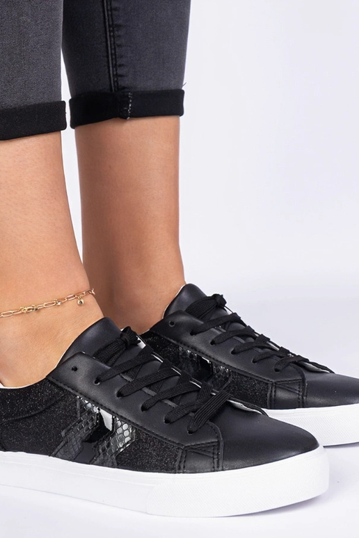 Sneakers nere con motivo animale...