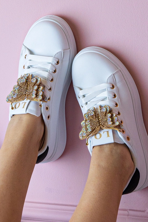 Sneakers bianchi e neri con farfalla...
