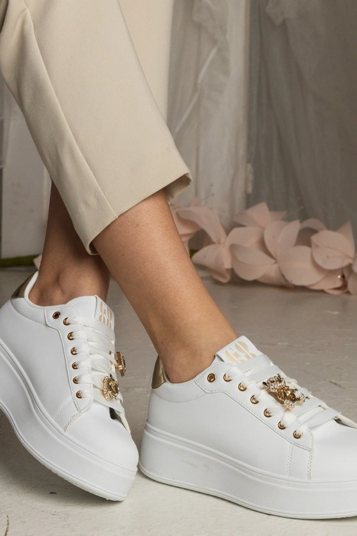 Sneakers bianche e dorate da donna...