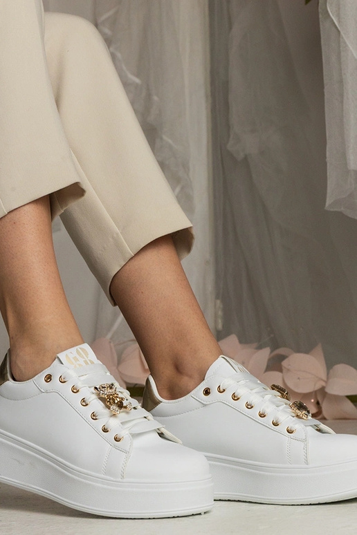 Sneakers bianche e dorate da donna...