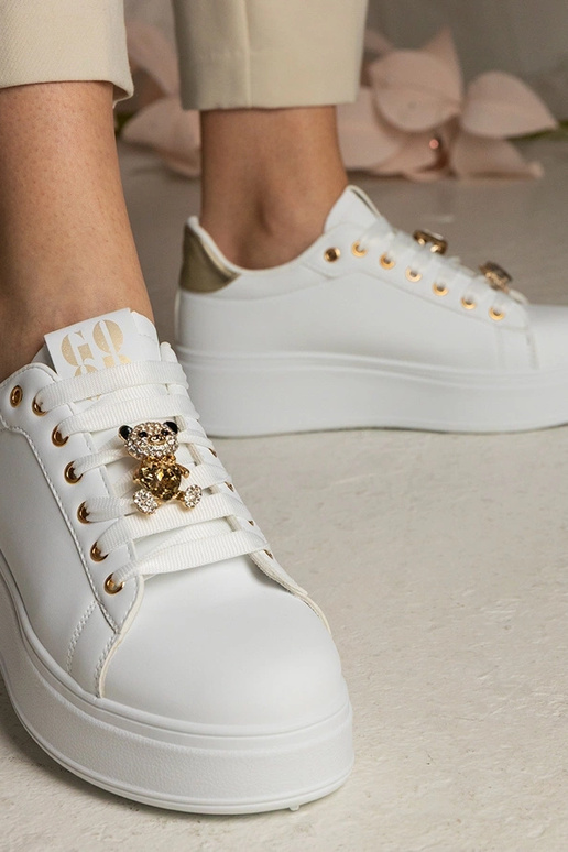 Sneakers bianche e dorate da donna...