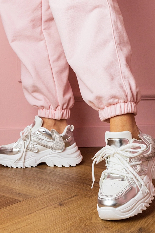 Scarpe sportive da donna bianche con... Scarpe sportive da donna bianche con...