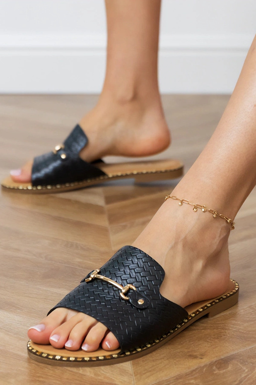 Pantofole nere piatte con cinturino...