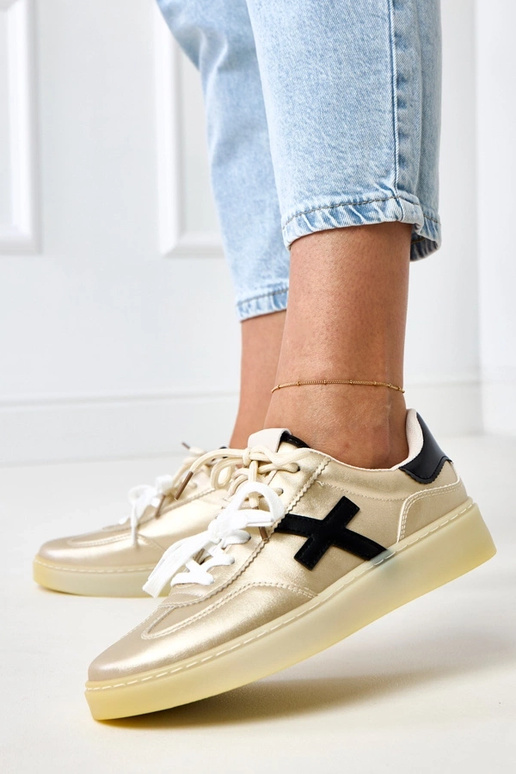 Sneaker dorate con piattaforma e...