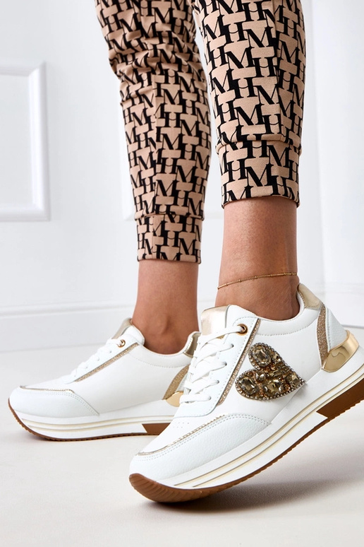 Scarpe sportive bianche con zeppa... Scarpe sportive bianche con zeppa...