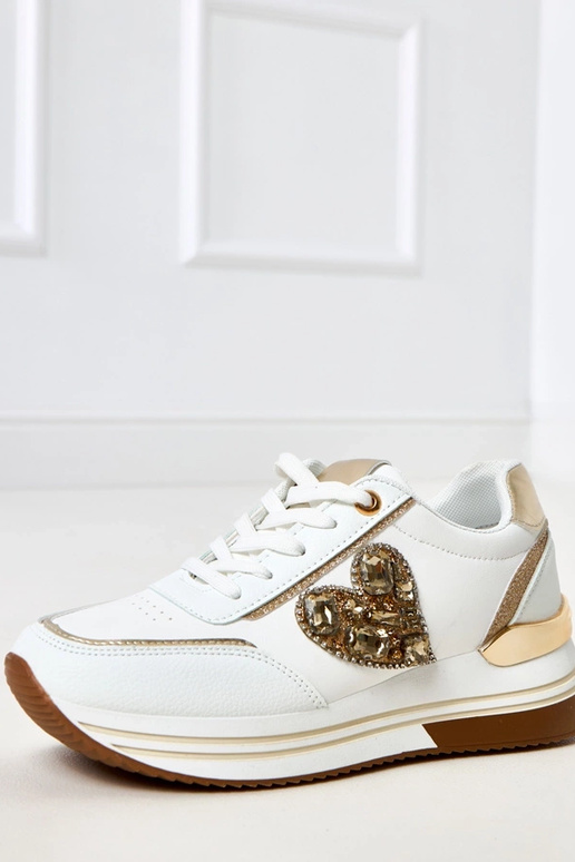 Scarpe sportive bianche con zeppa... Scarpe sportive bianche con zeppa...