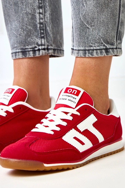 Scarpe sportive rosse con elementi...