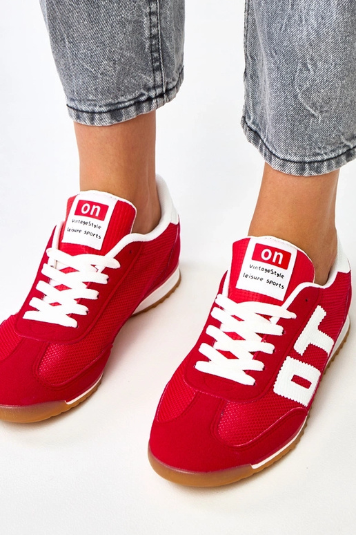 Scarpe sportive rosse con elementi...