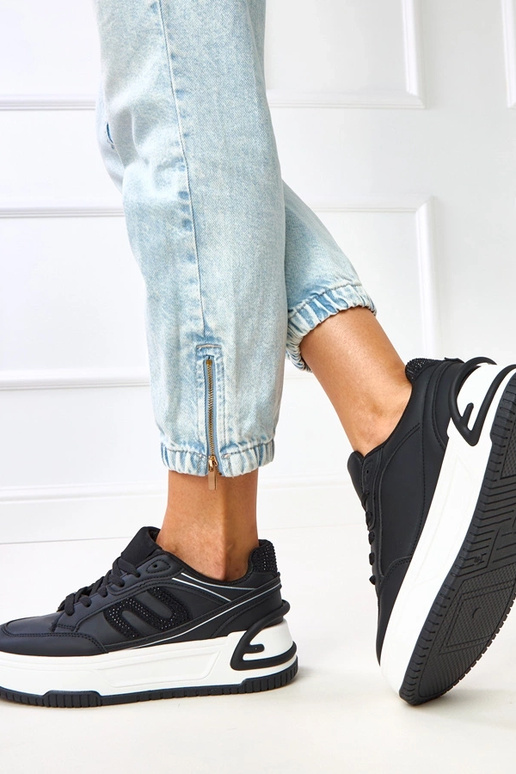 Sneakers nere con plateau decorate...