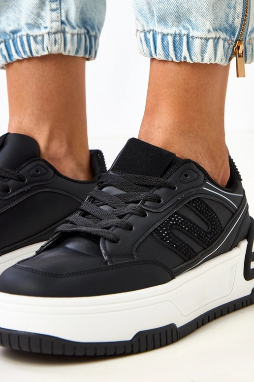 Sneakers nere con plateau decorate...