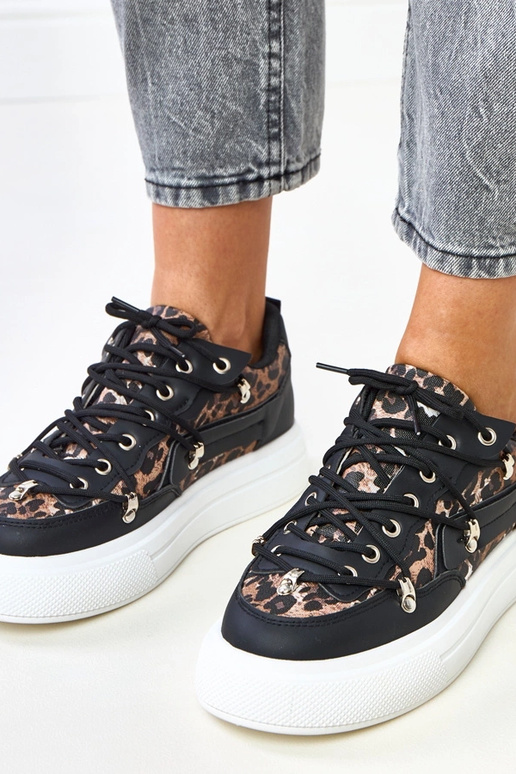 Sneakers bianco-neri con motivo...