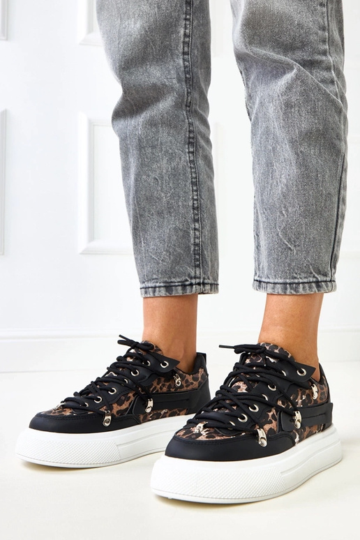 Sneakers bianco-neri con motivo...