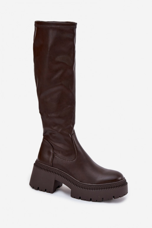 Stivali alti da donna con tacco massiccio e plateau modello slip-on di colore marrone Florinne Stivali alti da donna con tacco massiccio e plateau modello slip-on di colore marrone Florinne