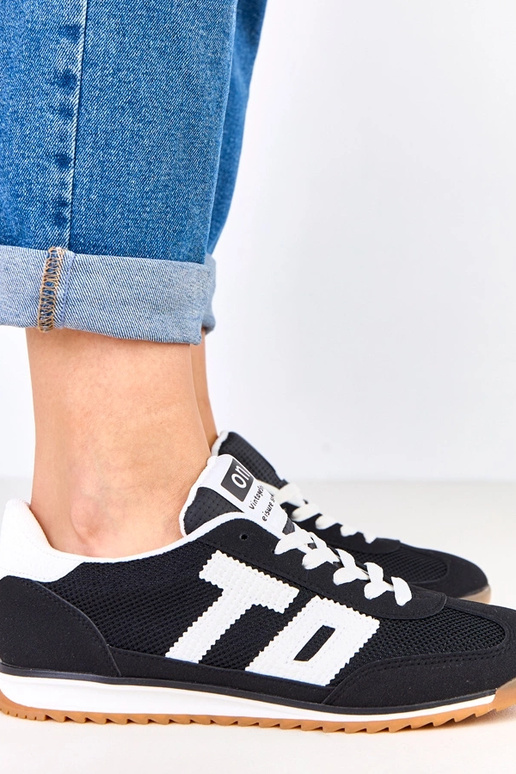 Scarpe sportive nere con dettagli...