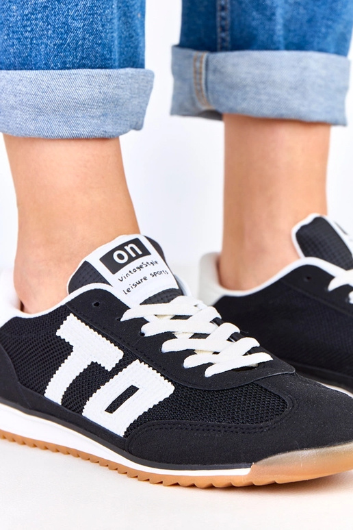 Scarpe sportive nere con dettagli...