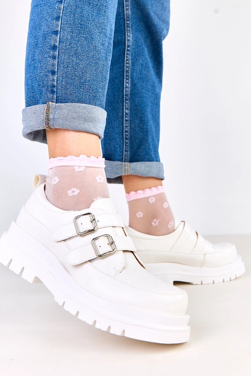 Stivaletti bianchi su suola...