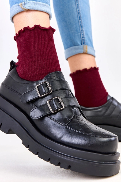 Stivaletti neri su suola massiccia,...