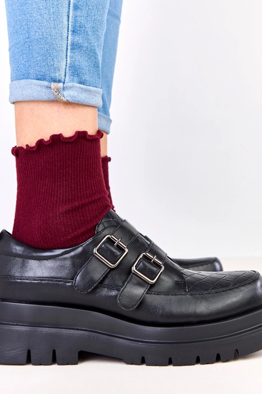 Stivaletti neri su suola massiccia,...