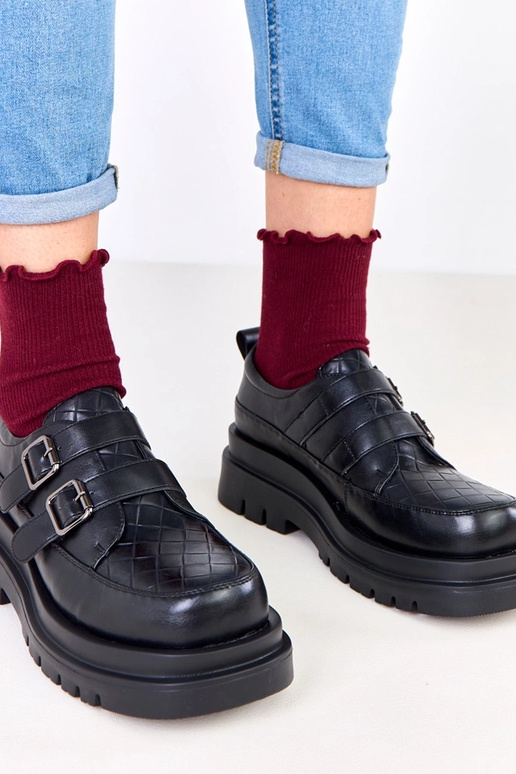 Stivaletti neri su suola massiccia,...