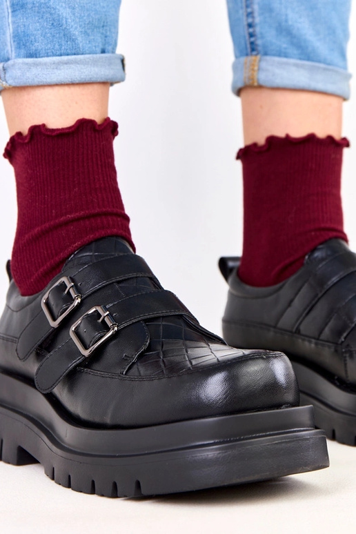 Stivaletti neri su suola massiccia,...