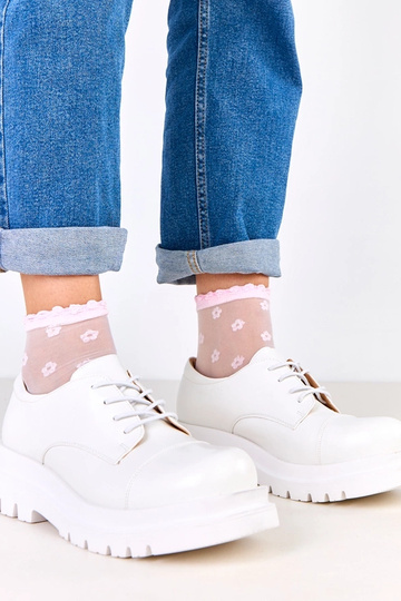 Stivaletti bianchi su suola...