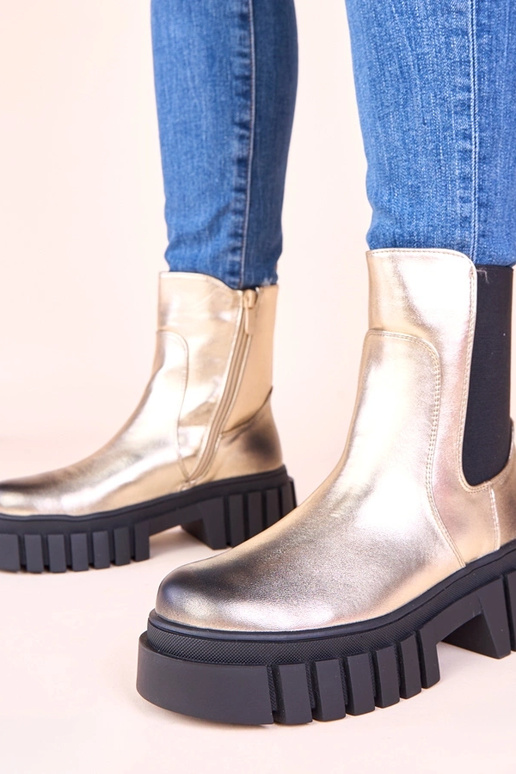 Stivaletti dorati con piattaforma e...