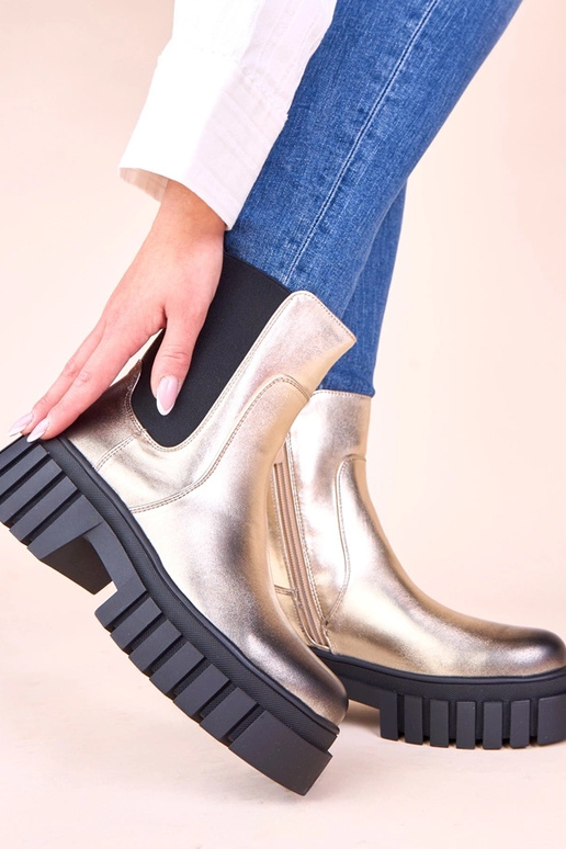 Stivaletti dorati con piattaforma e...