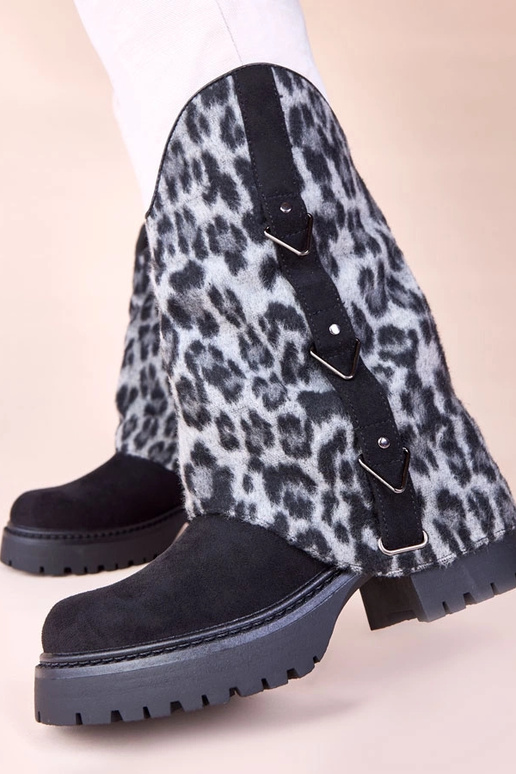 Stivaletti neri con gambale a motivo...