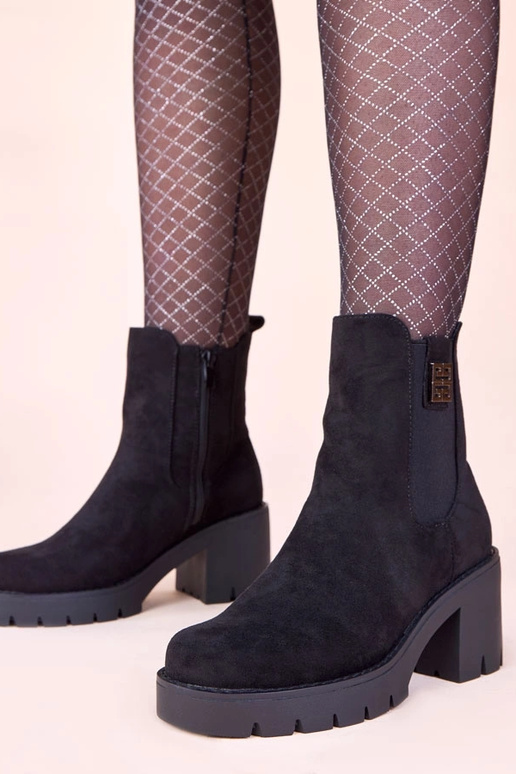 Stivaletti neri con tacco e elastico...