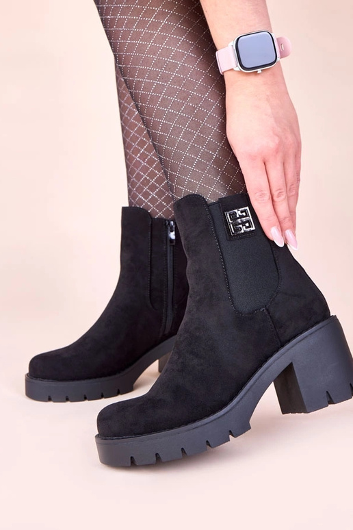 Stivaletti neri con tacco e elastico...