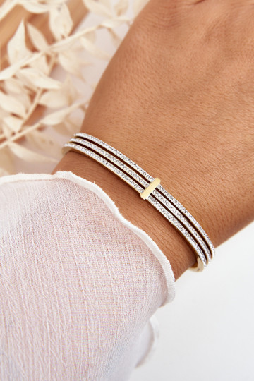 Un braccialetto dall acciaio inossidabile con gli occhi scintillanti colore dorato