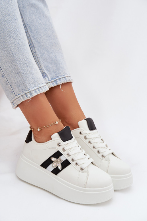 Scarpe modello sneakers Femminile con una piattaformaPrzypinką Colore bianco Palvessa