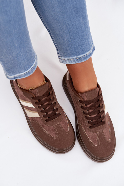 Scarpe modello sneakers Femminile con una piattaforma colore marrone Galleria