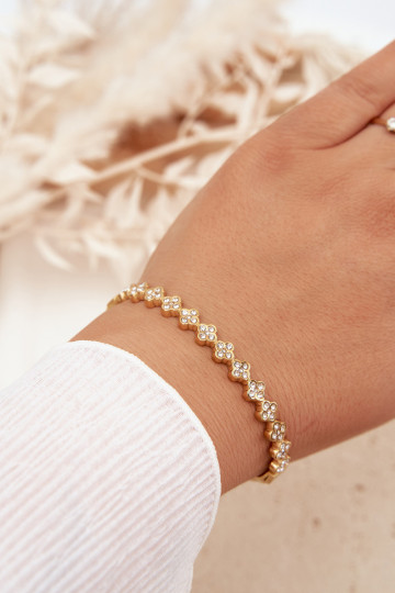 Un braccialetto Femminile con gli occhi scintillanti colore dorato