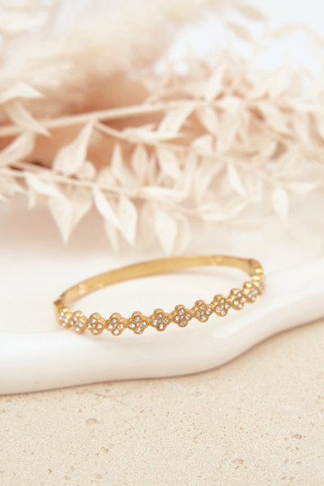 Un braccialetto Femminile con gli occhi scintillanti colore dorato 2