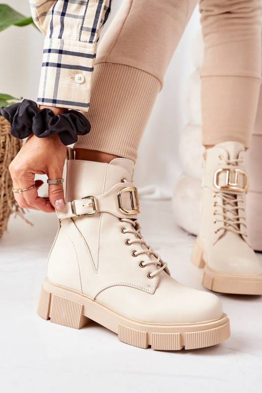 Stivali riscaldati con fibbie dorate in beige